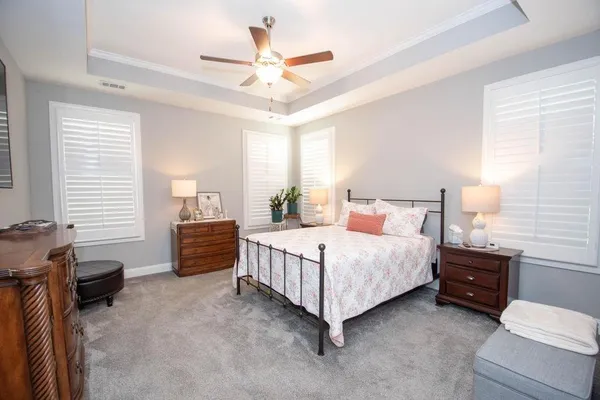 a bathroom with a glass shower door and a sink