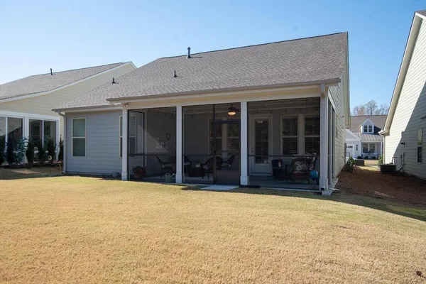 an aerial view of a house with a swimming pool