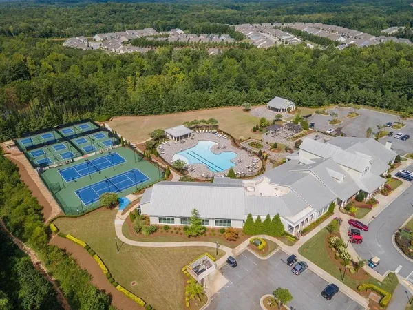an aerial view of a house with garden space and street view