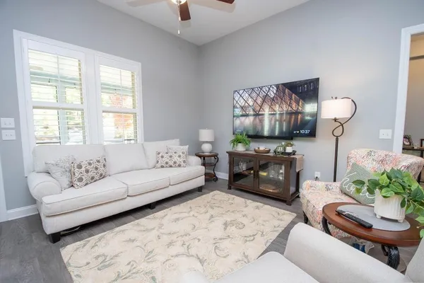 a living room with furniture and a fireplace