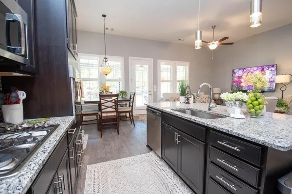 a kitchen with a table and chairs