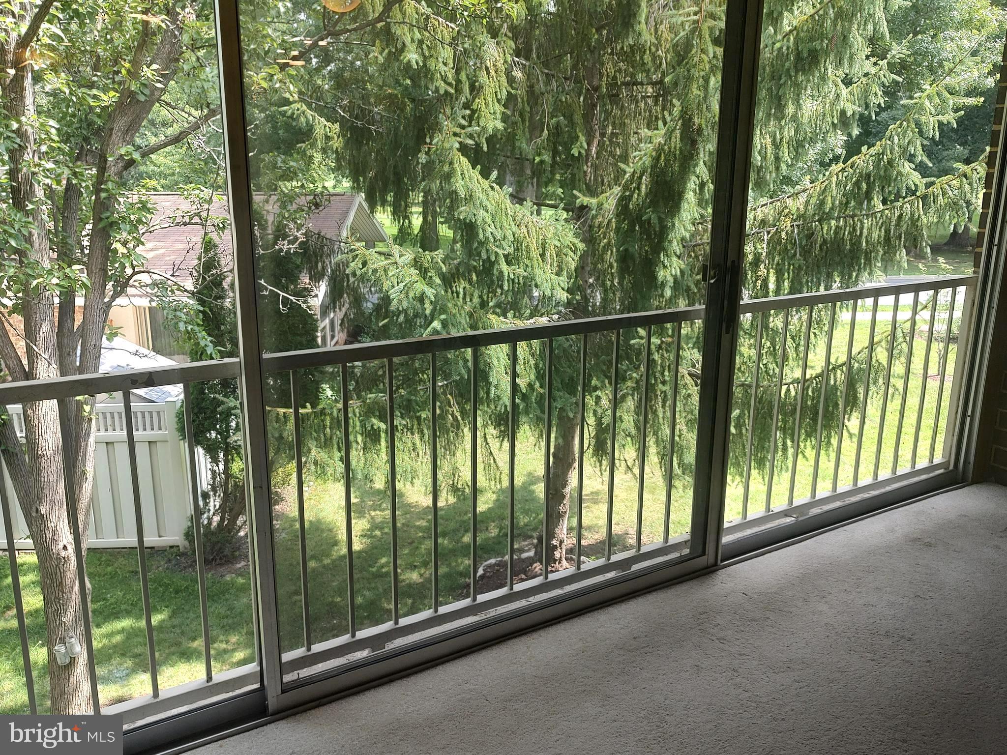 3576 Chiswick Court, Unit 342C Silver Spring, MD 20906 - Photo 6 of 16 Enclosed Balcony with view of trees