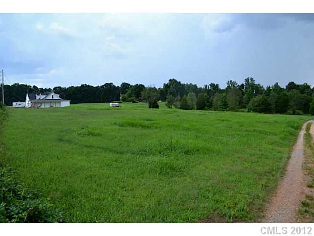 Lot 4 Mack Ballard Road Maiden, NC 28650 - Photo 3 of 16 a view of a grassy field with trees
