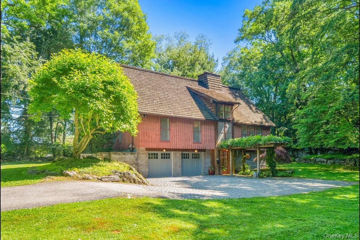 Welcome to 1821 Spring Valley Rd, a custom-built Craftsman set on 0.90 acres in the sought-after Teatown area of Croton.A Belgian block-lined driveway guides you to a charming courtyard as you near the home.