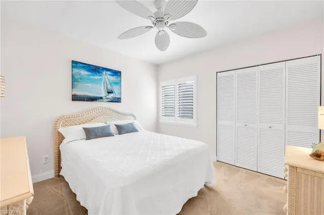 a spacious bedroom with a bed and a dresser