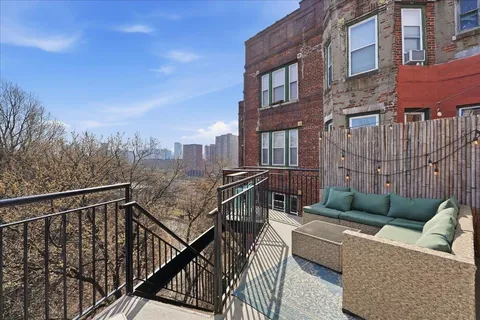 a view of a couches on the roof deck