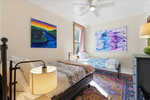 a bedroom with a bed and dresser