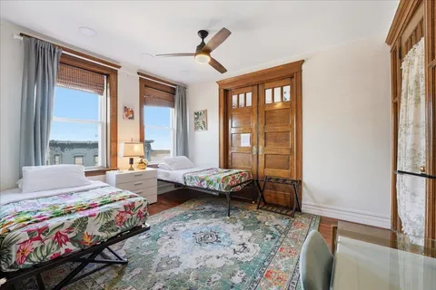 a bedroom with a bed and a window