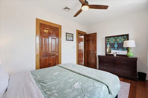 a bedroom with a bed and a dresser