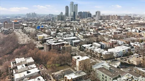 an aerial view of a city with lots of residential buildings