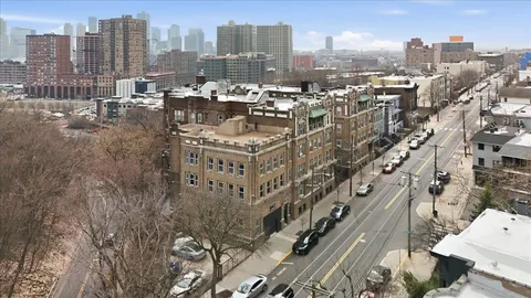 a view of a city with tall buildings