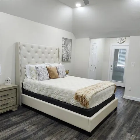 a bedroom with a bed and lamp