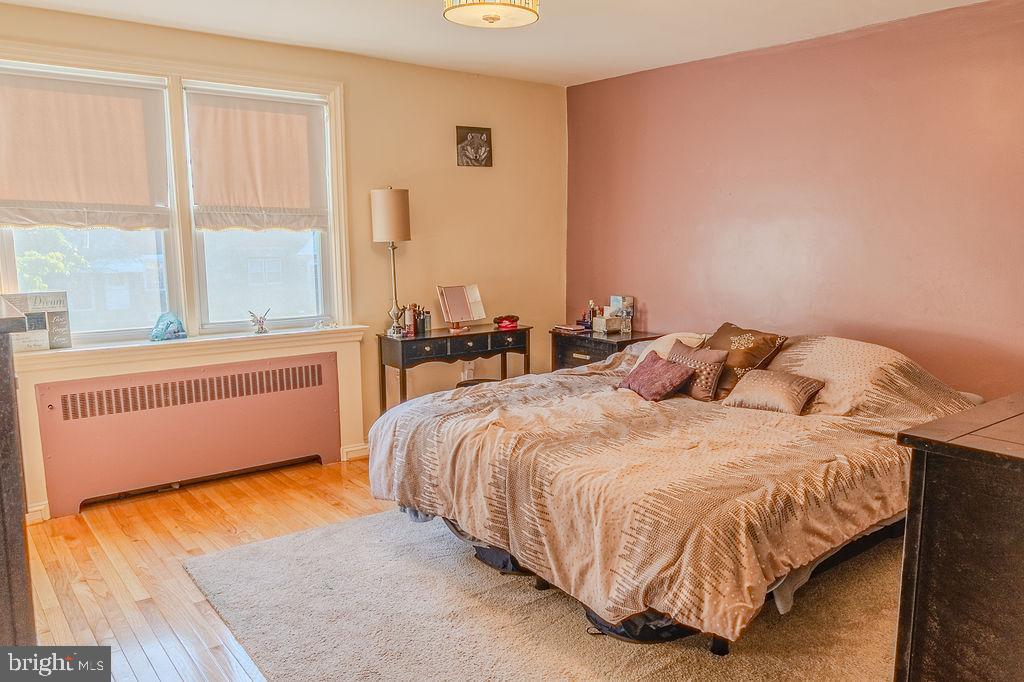 739 Fairfax Road Drexel Hill, PA 19026 - Photo 8 of 18 a bed sitting in a bedroom next to a window