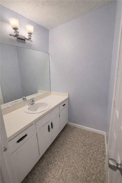 1637 Roman Point Drive Norcross, GA 30093 - Photo 6 of 9 a bathroom with a sink and a mirror