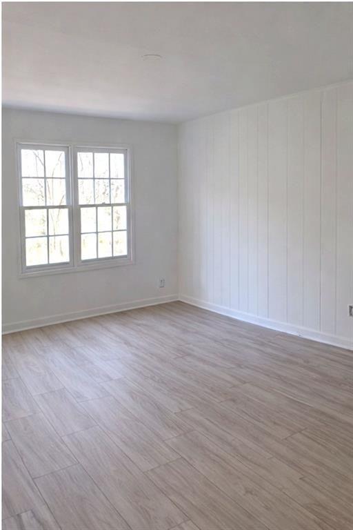 1637 Roman Point Drive Norcross, GA 30093 - Photo 8 of 9 an empty room with wooden floor and windows