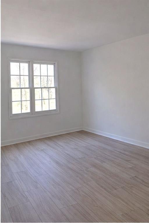 1637 Roman Point Drive Norcross, GA 30093 - Photo 9 of 9 wooden floor and window in an empty room