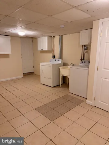 a room with a sink and a mirror