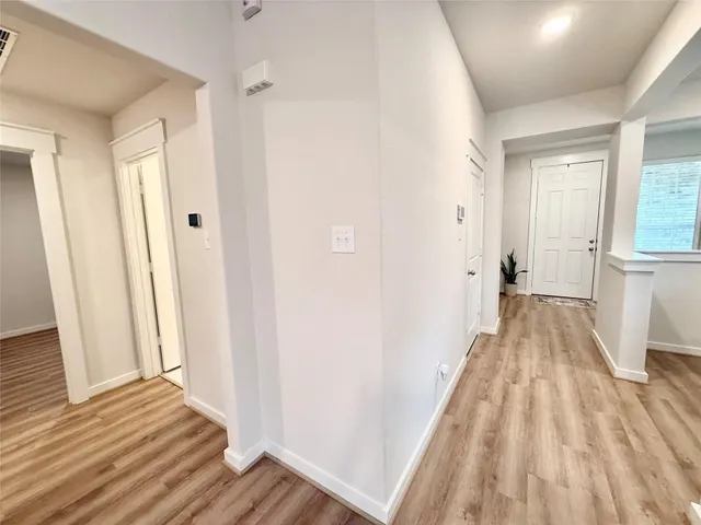 a view of a room with wooden floor and staircase