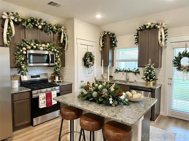 a living room with furniture a view of bedroom and a couch