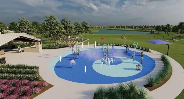 a view of a chair and table in backyard of the house