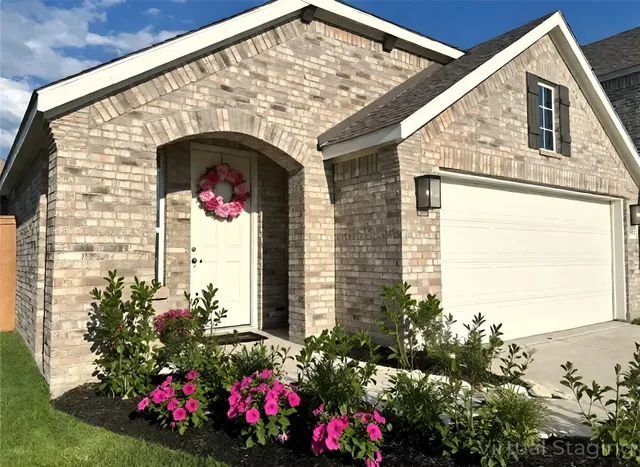 a view of building with flowers