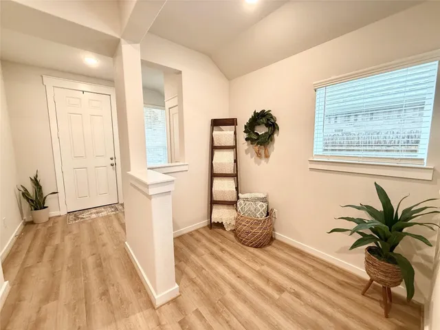 a bedroom with a bed and a large mirror
