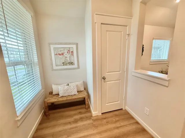 a bathroom with a window and a shower