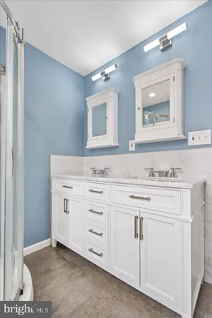 a bathroom with a sink a vanity and a mirror