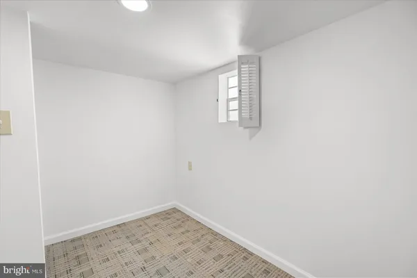 a view of a room that has a window in it