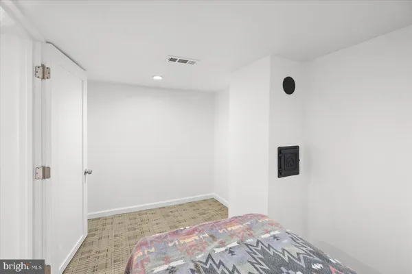 a view of a closet area with a ceiling fan