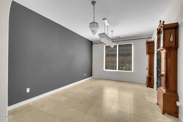 a bed room with a bed mirror and a window