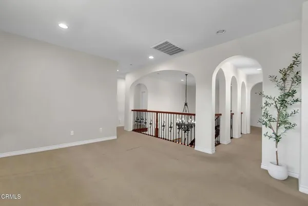 a white toilet sitting next to a bath tub