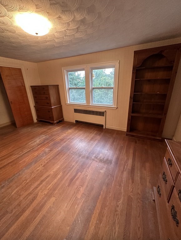 72 Redlands Road Boston, MA 02132 - Photo 12 of 19 wooden floor in an empty room with a window