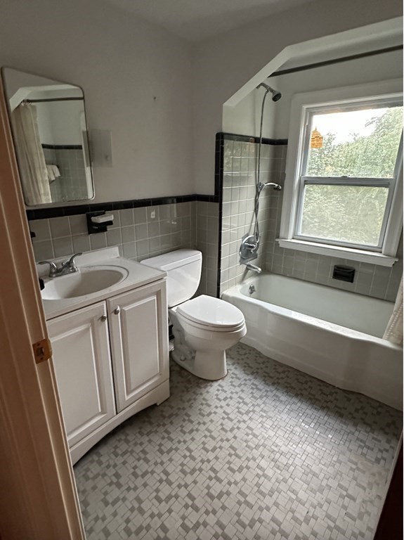 72 Redlands Road Boston, MA 02132 - Photo 13 of 19 a bathroom with a granite countertop toilet a sink and a bathtub