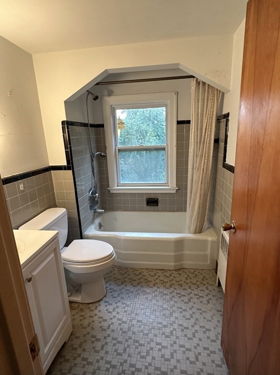 72 Redlands Road Boston, MA 02132 - Photo 14 of 19 a bathroom with a toilet a sink and a bathtub