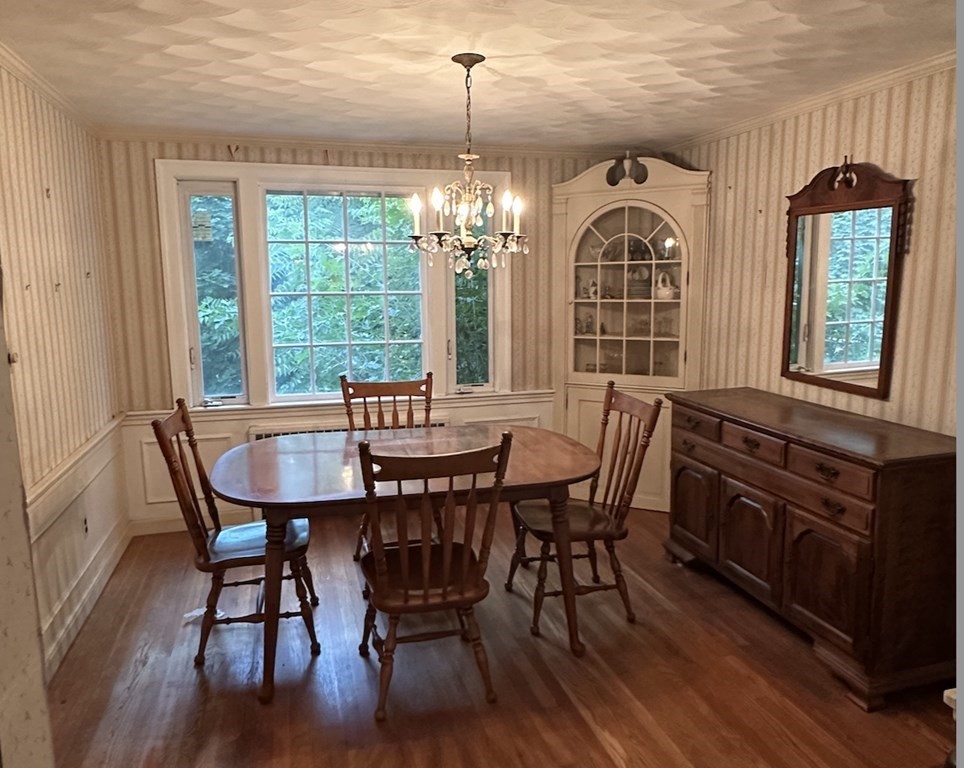 72 Redlands Road Boston, MA 02132 - Photo 2 of 19 a view of a a dining room with furniture window and wooden floor