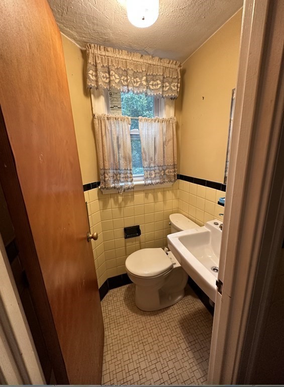 72 Redlands Road Boston, MA 02132 - Photo 4 of 19 a bathroom with a sink and a mirror