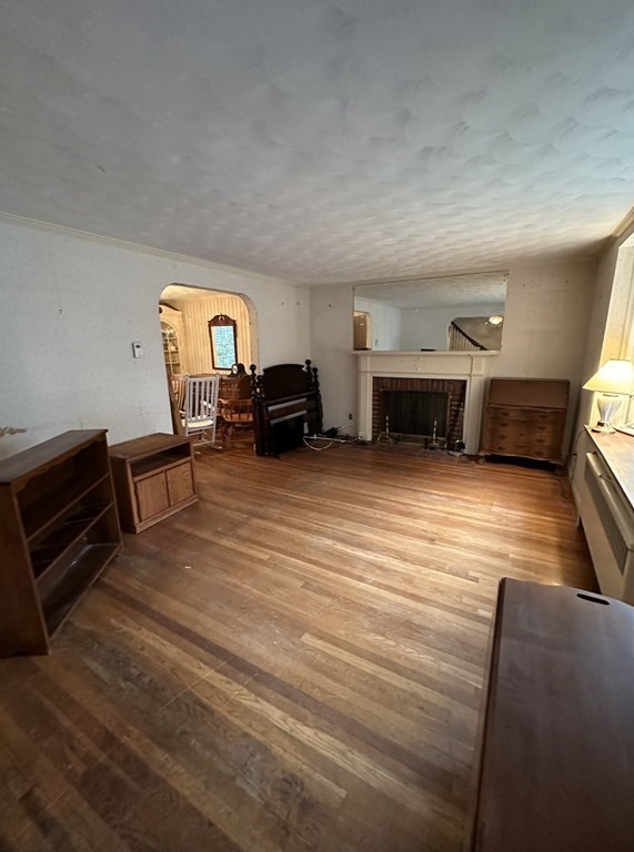 72 Redlands Road Boston, MA 02132 - Photo 7 of 19 a living room with furniture and a flat screen tv