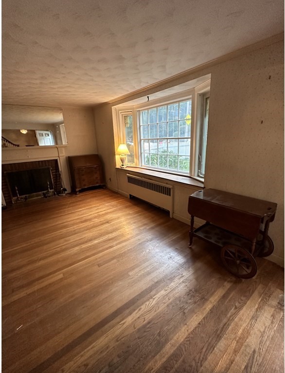 72 Redlands Road Boston, MA 02132 - Photo 8 of 19 a living room with furniture and a window