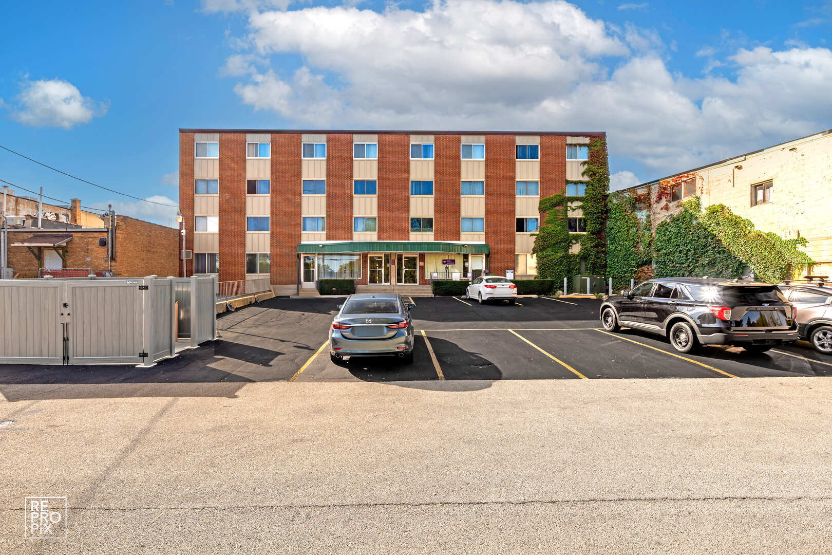 2671 Sheridan Road Zion, IL 60099 - Photo 4 of 10 a view of a patio with a table and chairs and potted plants