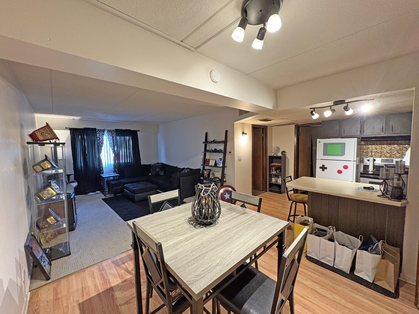 2671 Sheridan Road Zion, IL 60099 - Photo 7 of 10 a kitchen and a dining room with wooden floor