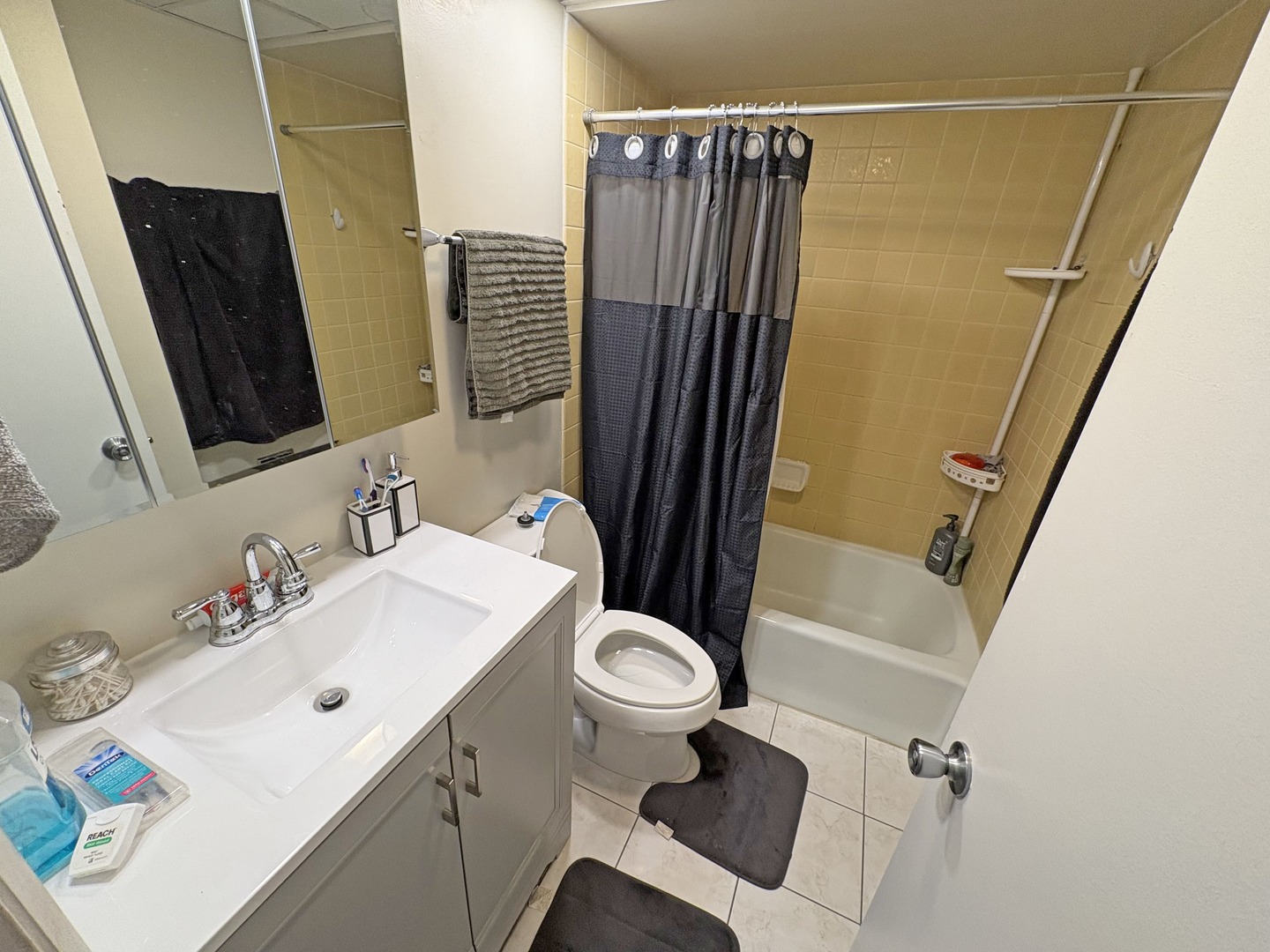 2671 Sheridan Road Zion, IL 60099 - Photo 8 of 10 a bathroom with a sink toilet and shower