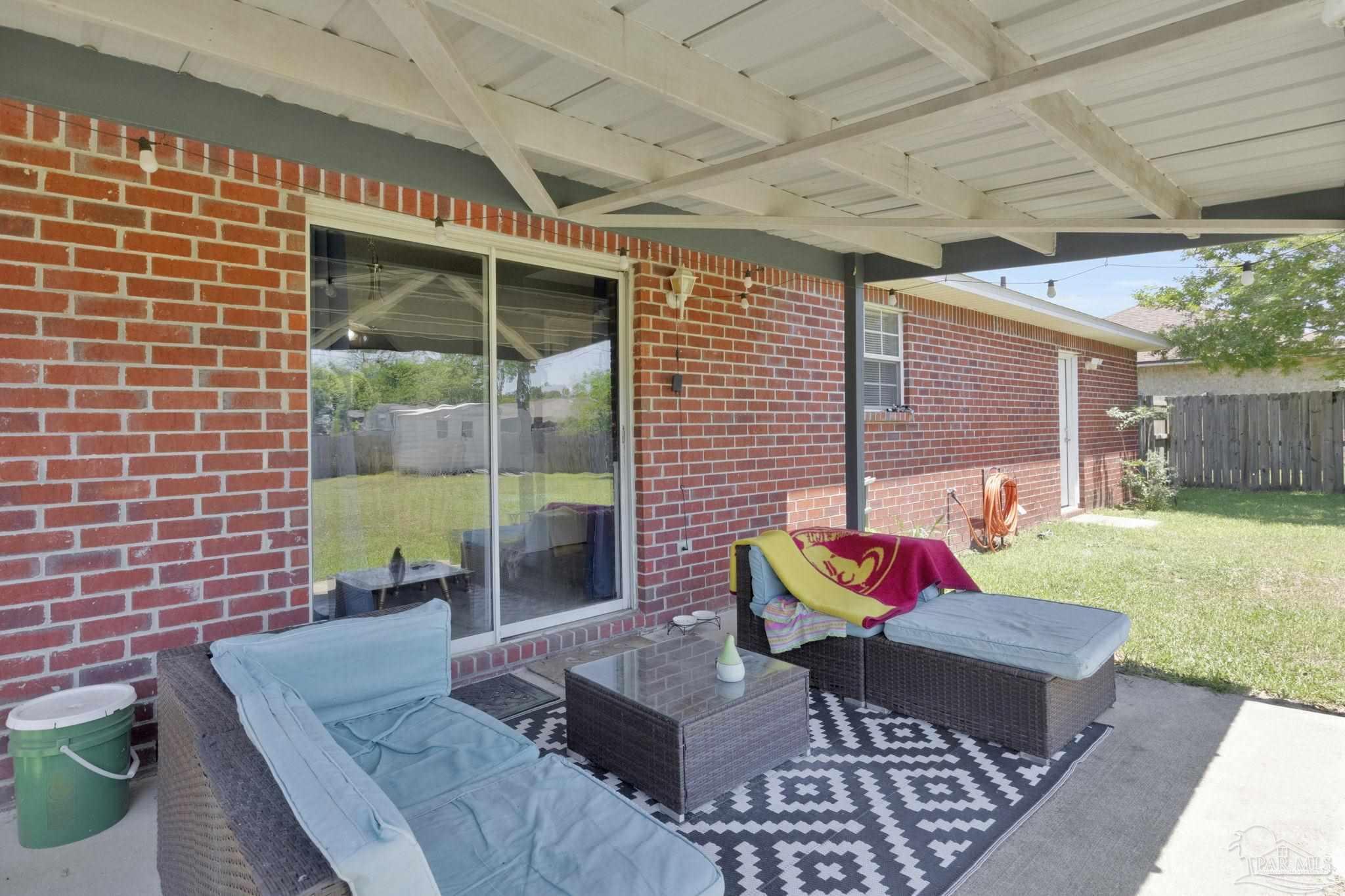 5539 Windrun Place Pace, FL 32571 - Photo 35 of 62 a outdoor living space with furniture