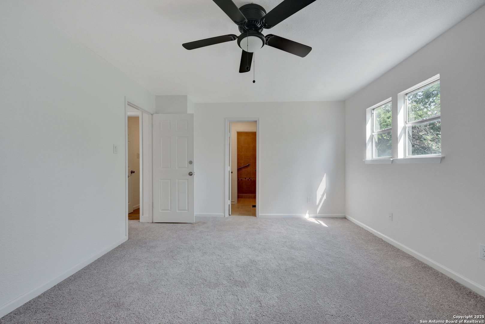 8903 Ridge Sky Street San Antonio, TX 78250 - Photo 12 of 20 a view of an empty room with a window