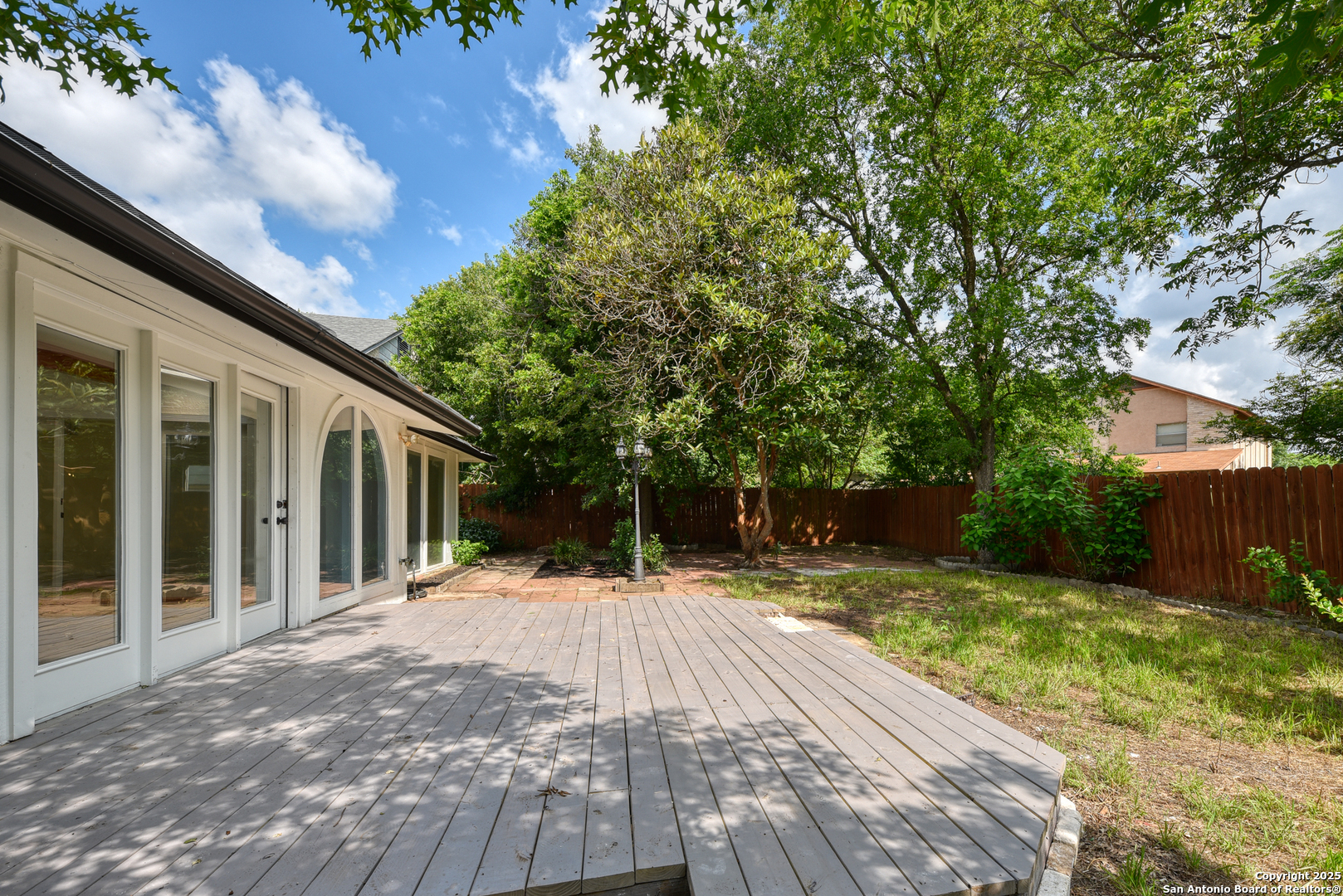 8903 Ridge Sky Street San Antonio, TX 78250 - Photo 5 of 7 a house with trees in front of it