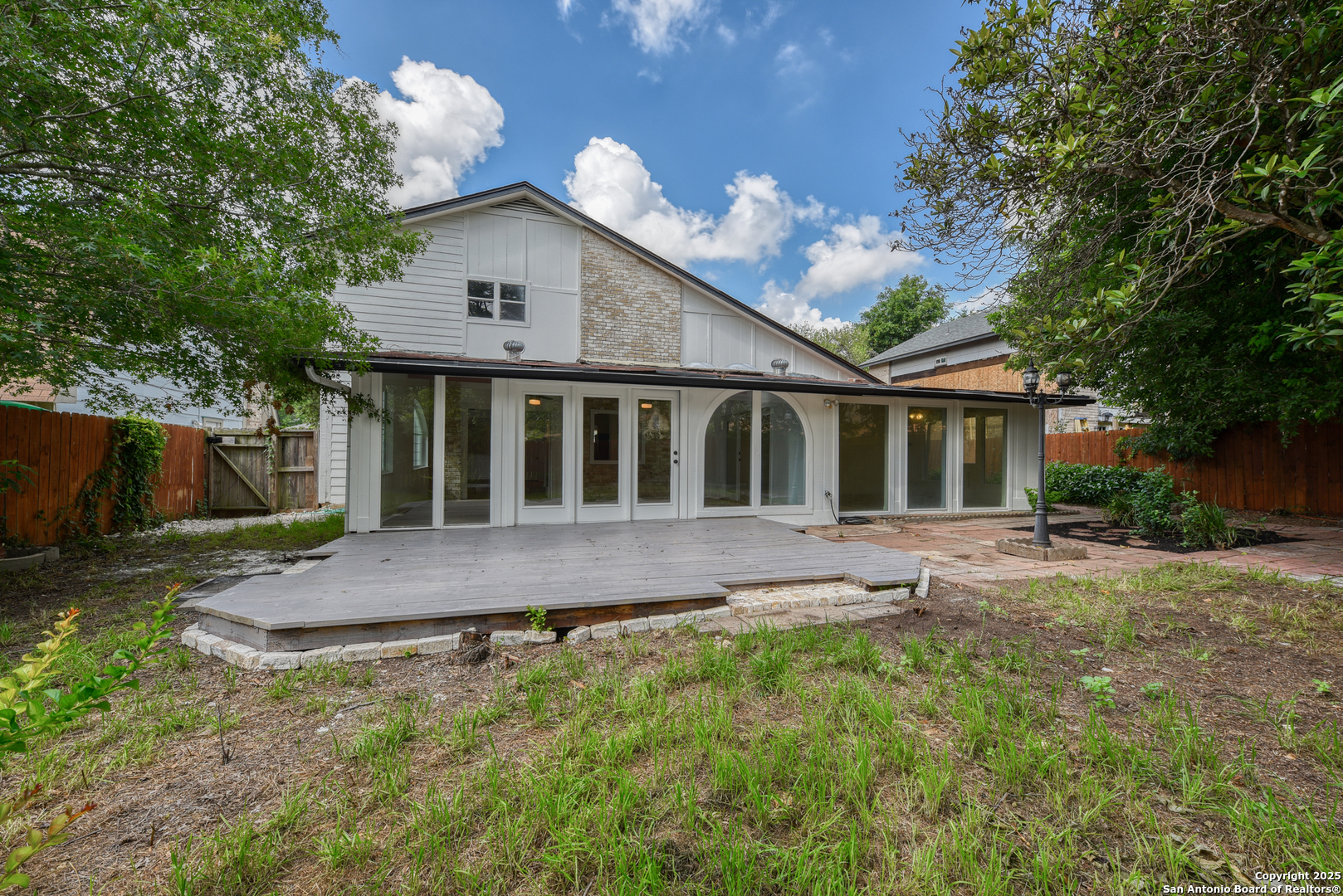 8903 Ridge Sky Street San Antonio, TX 78250 - Photo 6 of 7 a view of a house with a yard and tree s