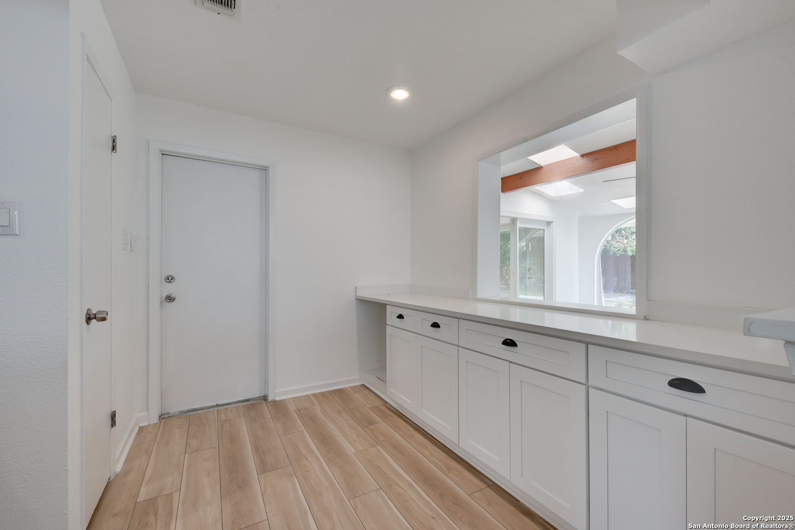 8903 Ridge Sky Street San Antonio, TX 78250 - Photo 7 of 20 a view of cabinets with wooden floor