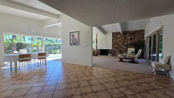 a view of a livingroom with furniture and a window