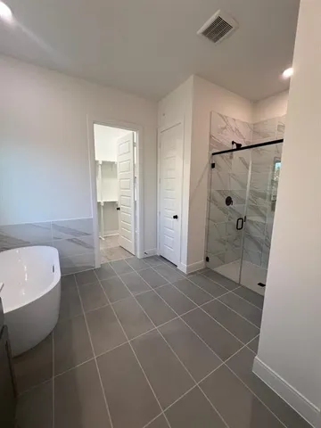 a bathroom with a shower and a toilet