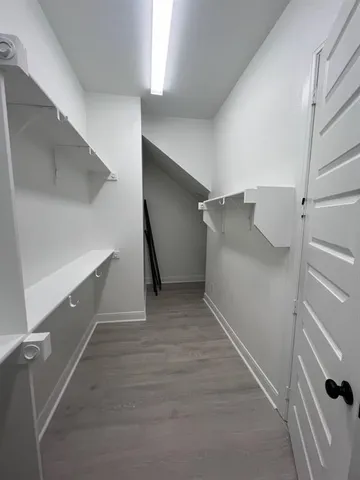 a view of an empty walk in closet